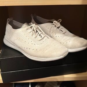 White and metallic women’s Cole Haan sneakers